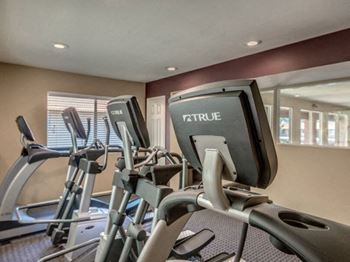 Equipment in gym at Canyon Club Apartments, Upland